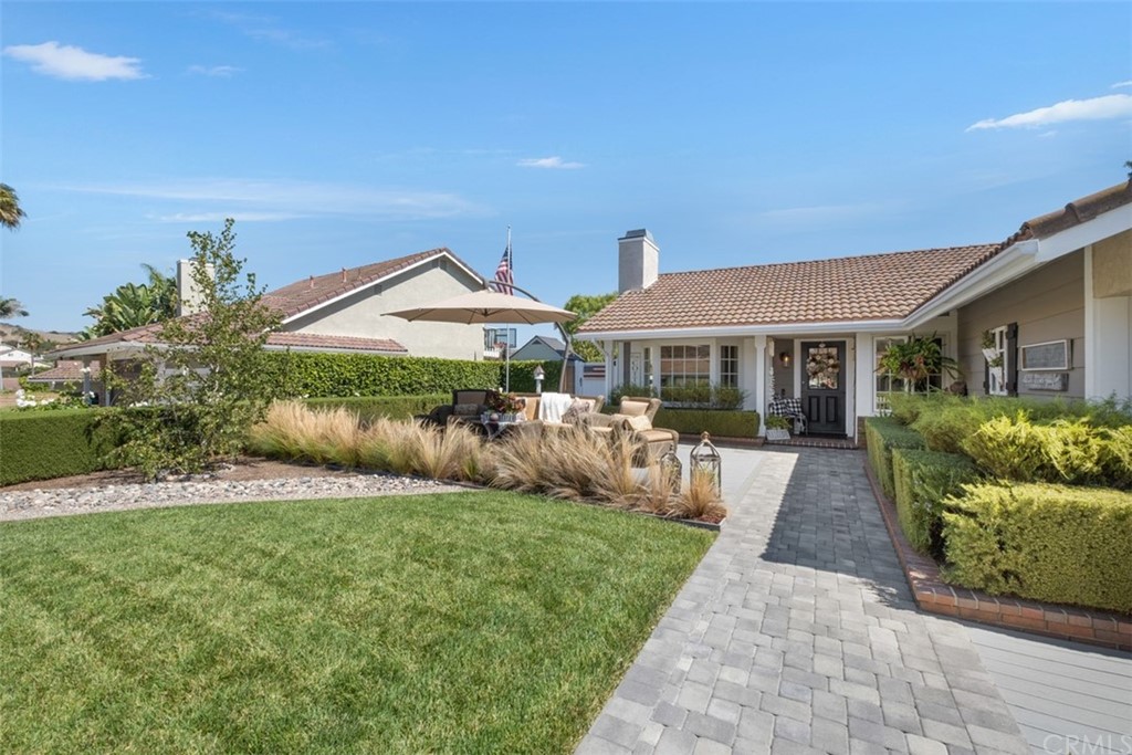 2933 Estancia San Clemente, CA 92673 - Photo 5 of 59 a front view of house with yard and green space