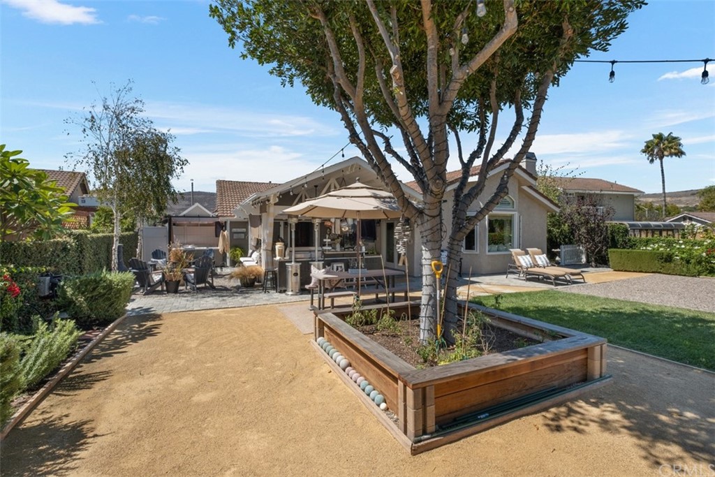 2933 Estancia San Clemente, CA 92673 - Photo 45 of 59 a front view of a house with fountain and tree s