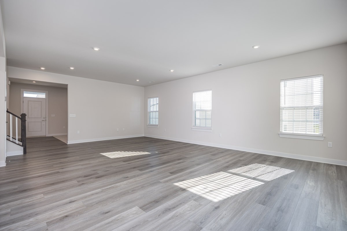 968 Caywood Road Smyrna, TN 37167 - Photo 13 of 54 a view of an empty room with wooden floor and a window