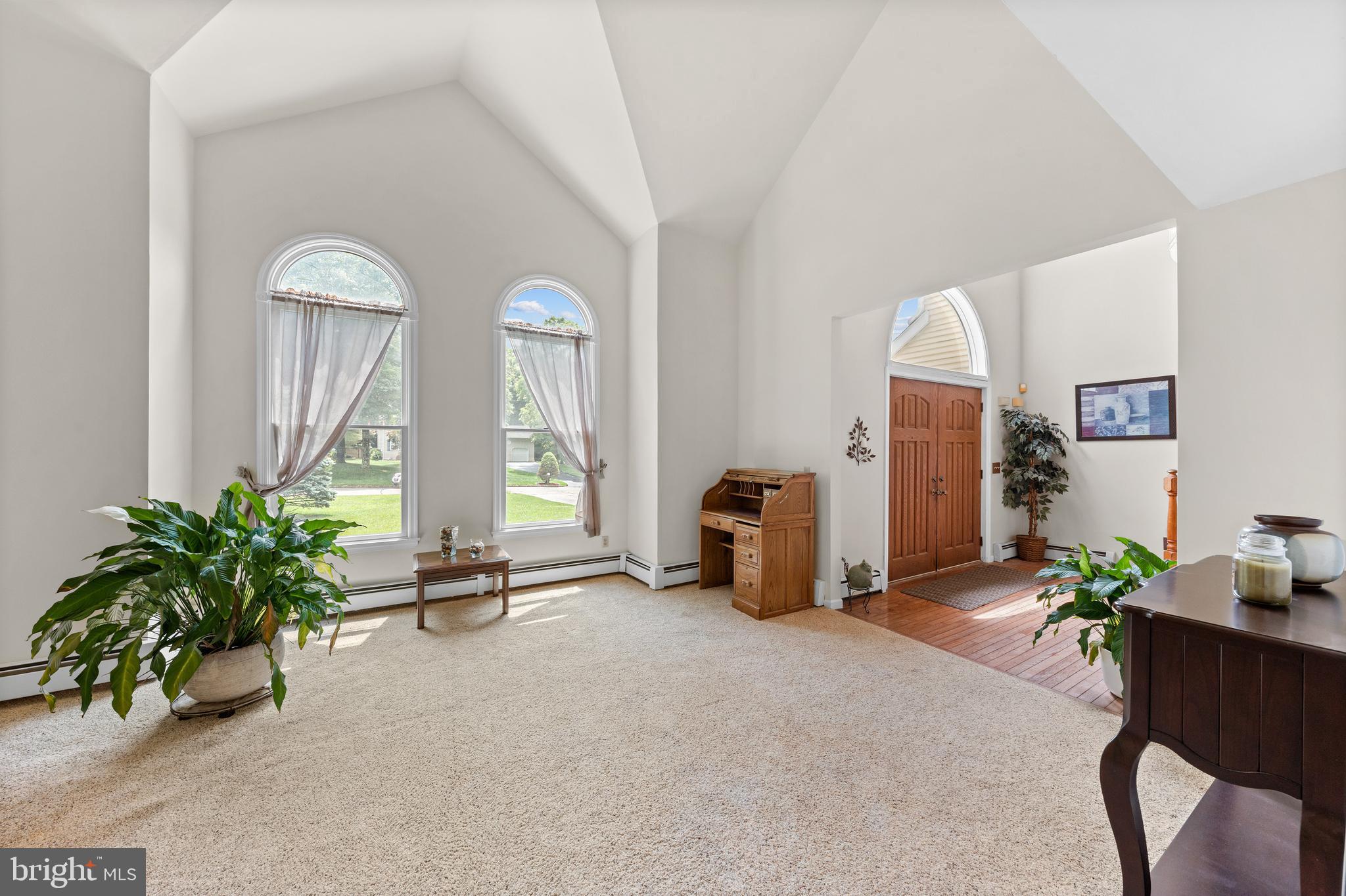 9 Jessica Court Lake Hopatcong, NJ 07849 - Photo 14 of 47 a view of a livingroom with furniture and a potted plant