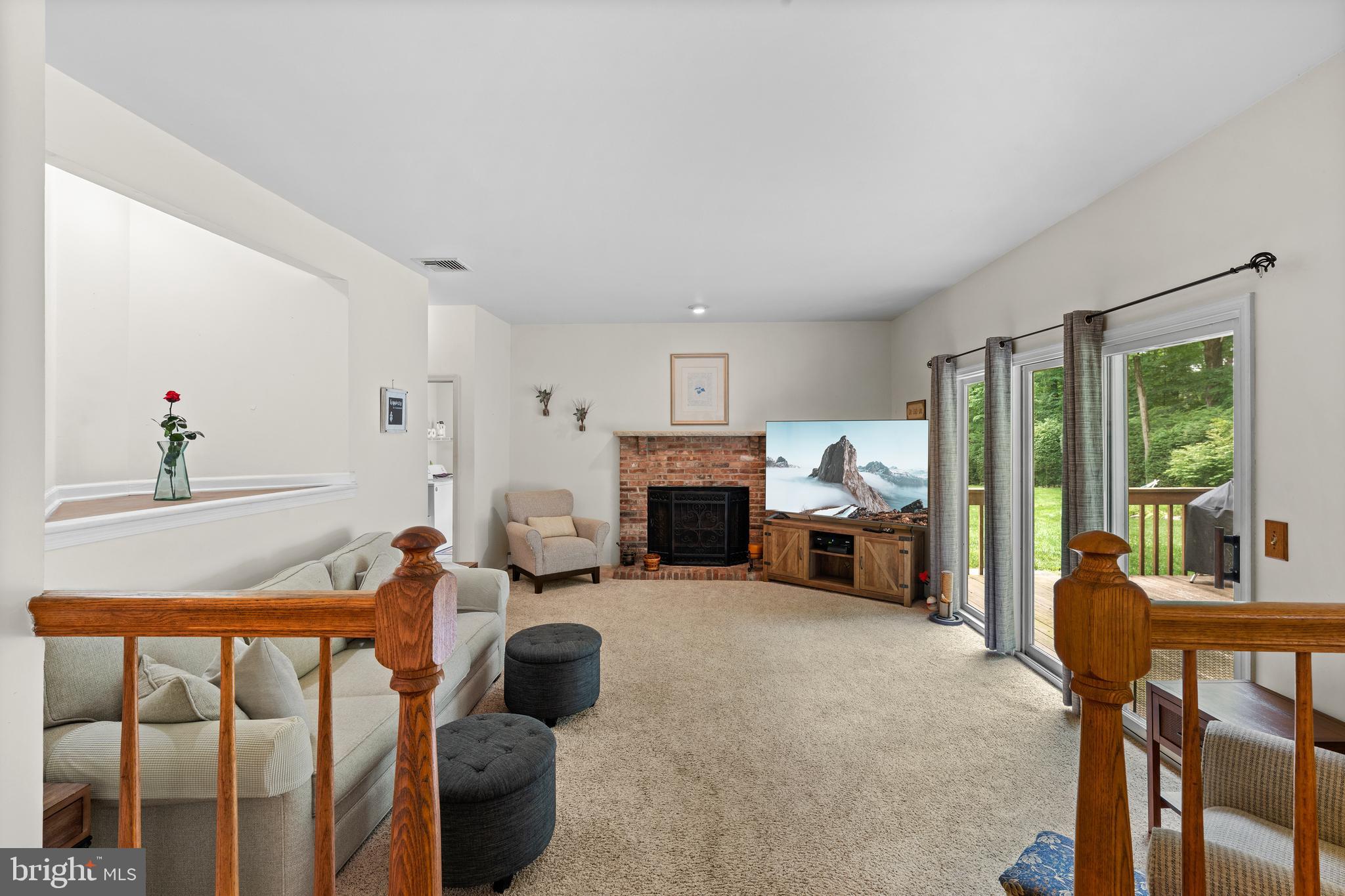 9 Jessica Court Lake Hopatcong, NJ 07849 - Photo 23 of 47 a living room with furniture and a fireplace