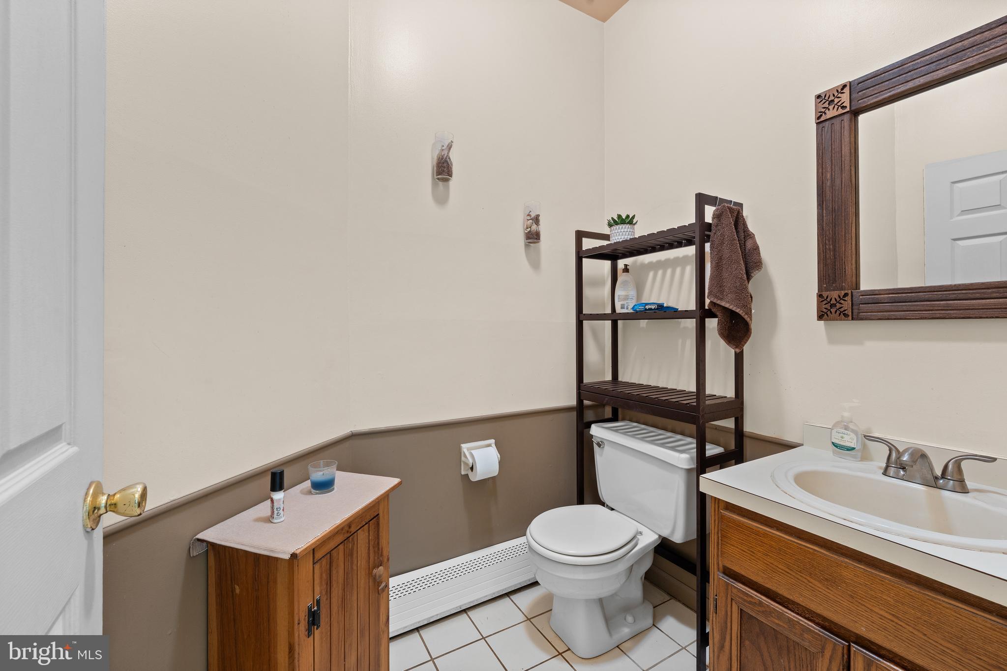 9 Jessica Court Lake Hopatcong, NJ 07849 - Photo 24 of 47 a bathroom with a sink a toilet and mirror