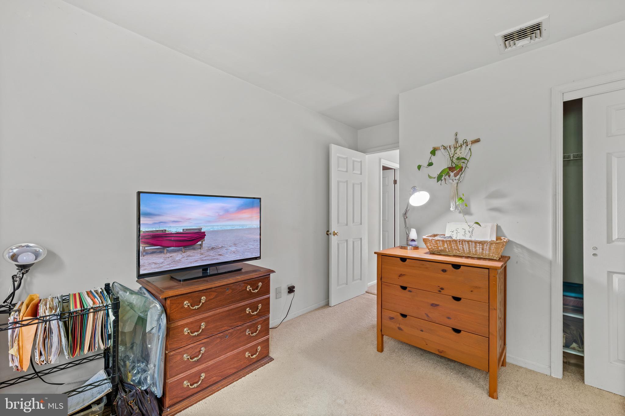 9 Jessica Court Lake Hopatcong, NJ 07849 - Photo 35 of 47 a living room with furniture and a flat screen tv