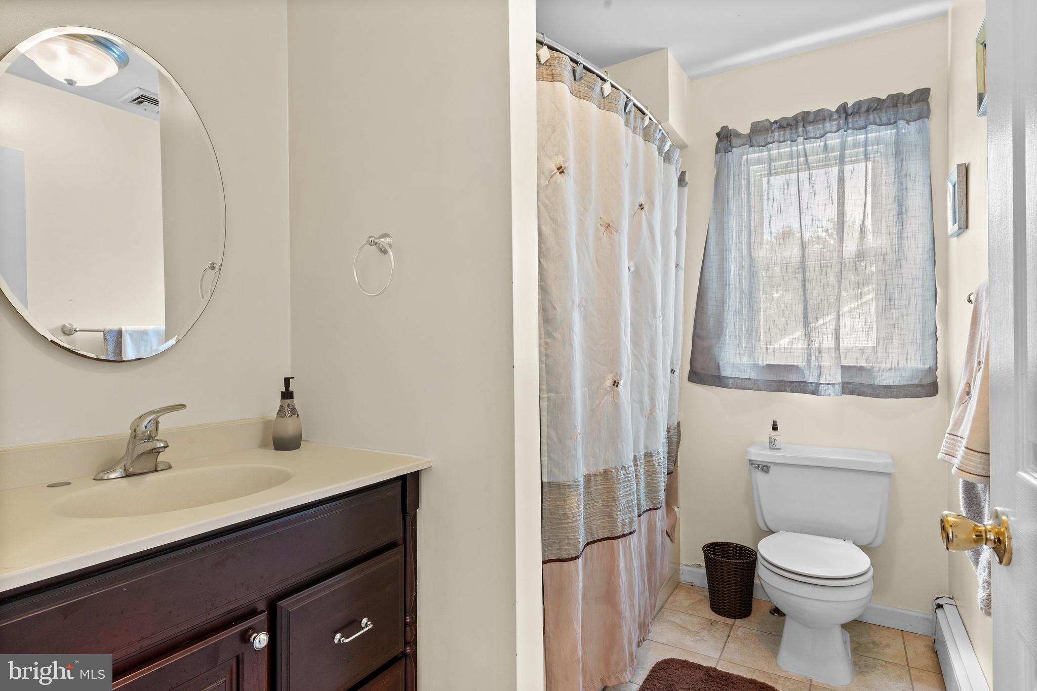 9 Jessica Court Lake Hopatcong, NJ 07849 - Photo 38 of 47 a bathroom with a sink a toilet and shower