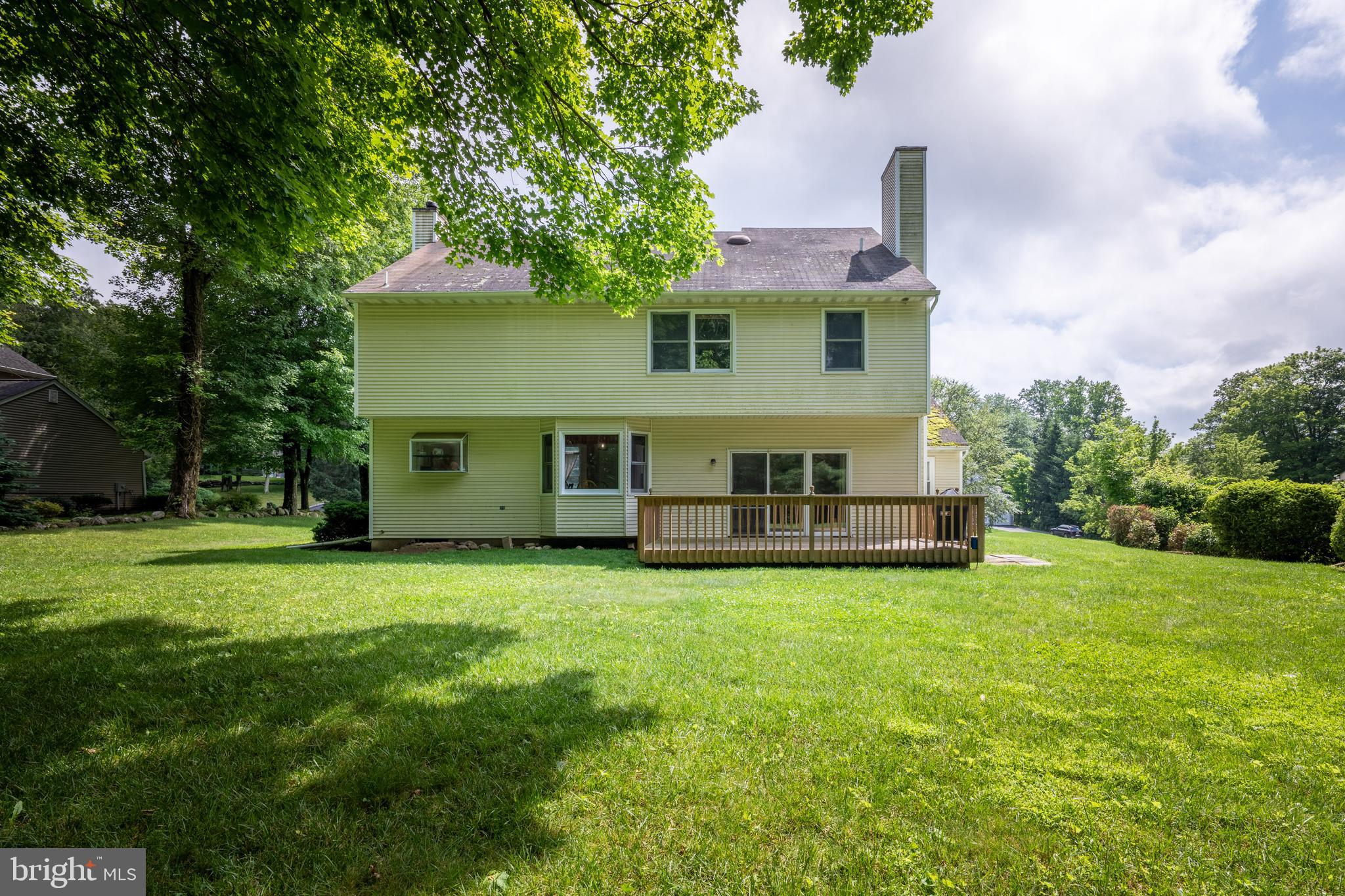 9 Jessica Court Lake Hopatcong, NJ 07849 - Photo 45 of 47 a front view of a house with a garden and trees