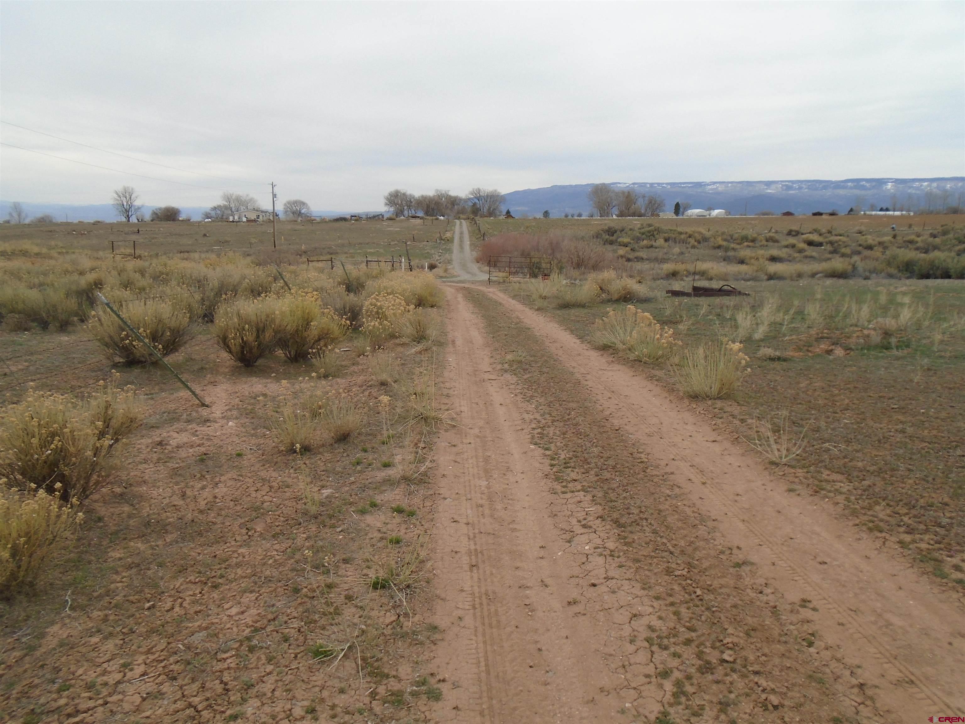 14994 2600th Road Cedaredge, CO 81413 - Photo 4 of 4 a view of a lake with a city