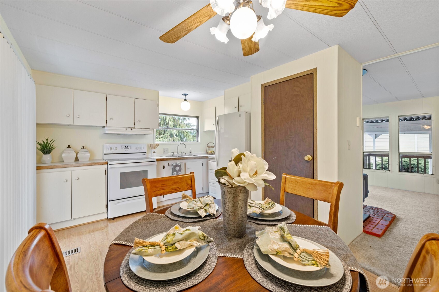 11 Juniper Mobile Estate Sequim, WA 98382 - Photo 12 of 31 a open dining room with furniture and a kitchen