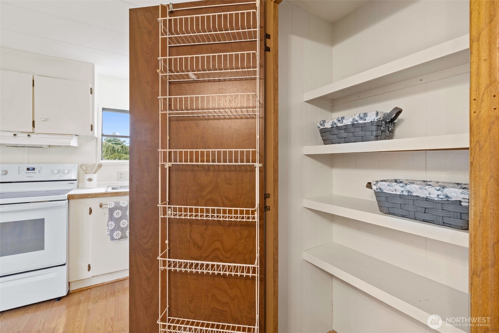 11 Juniper Mobile Estate Sequim, WA 98382 - Photo 15 of 31 a cabinet with window and white cabinets