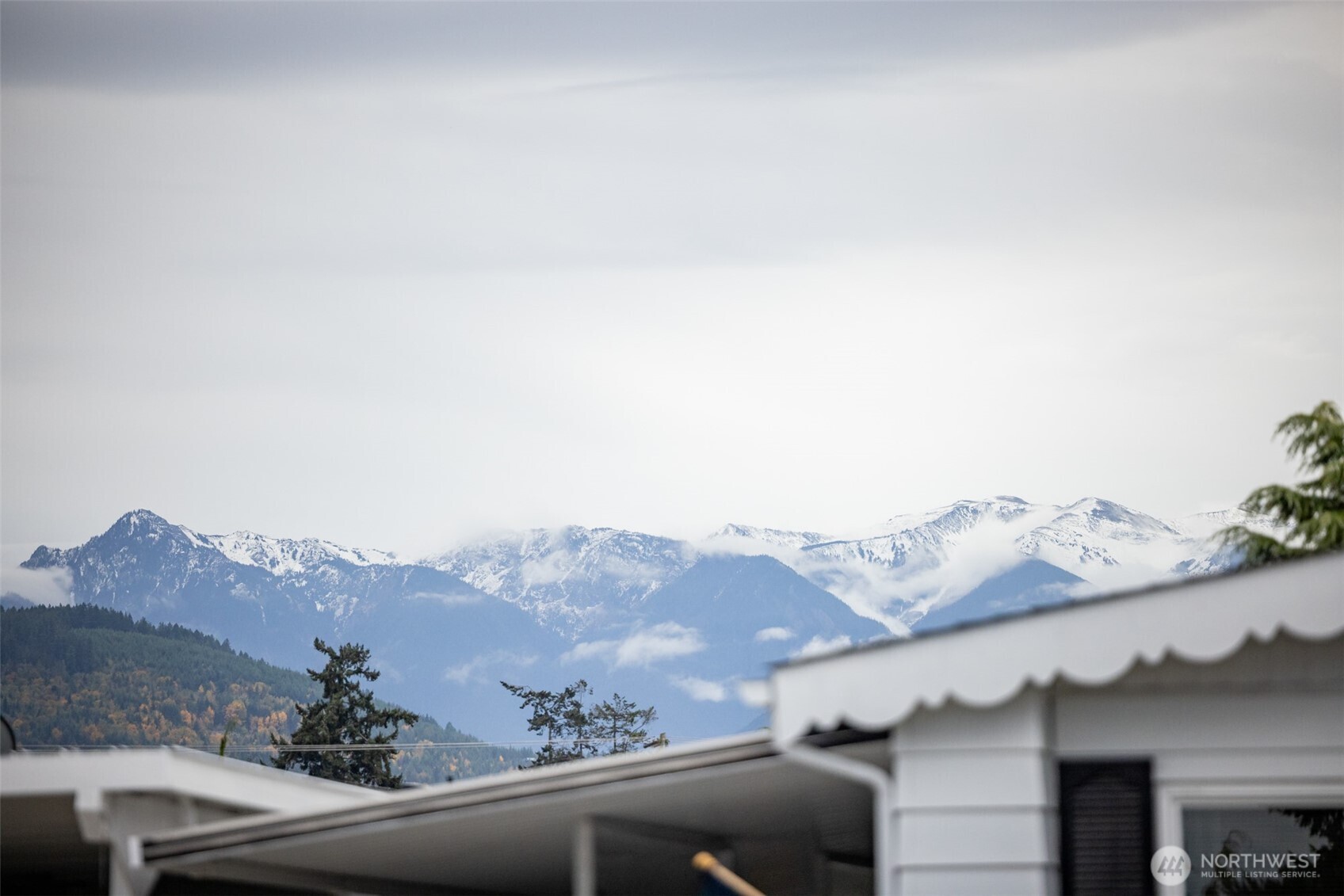 11 Juniper Mobile Estate Sequim, WA 98382 - Photo 2 of 31 a view of a house with a mountain