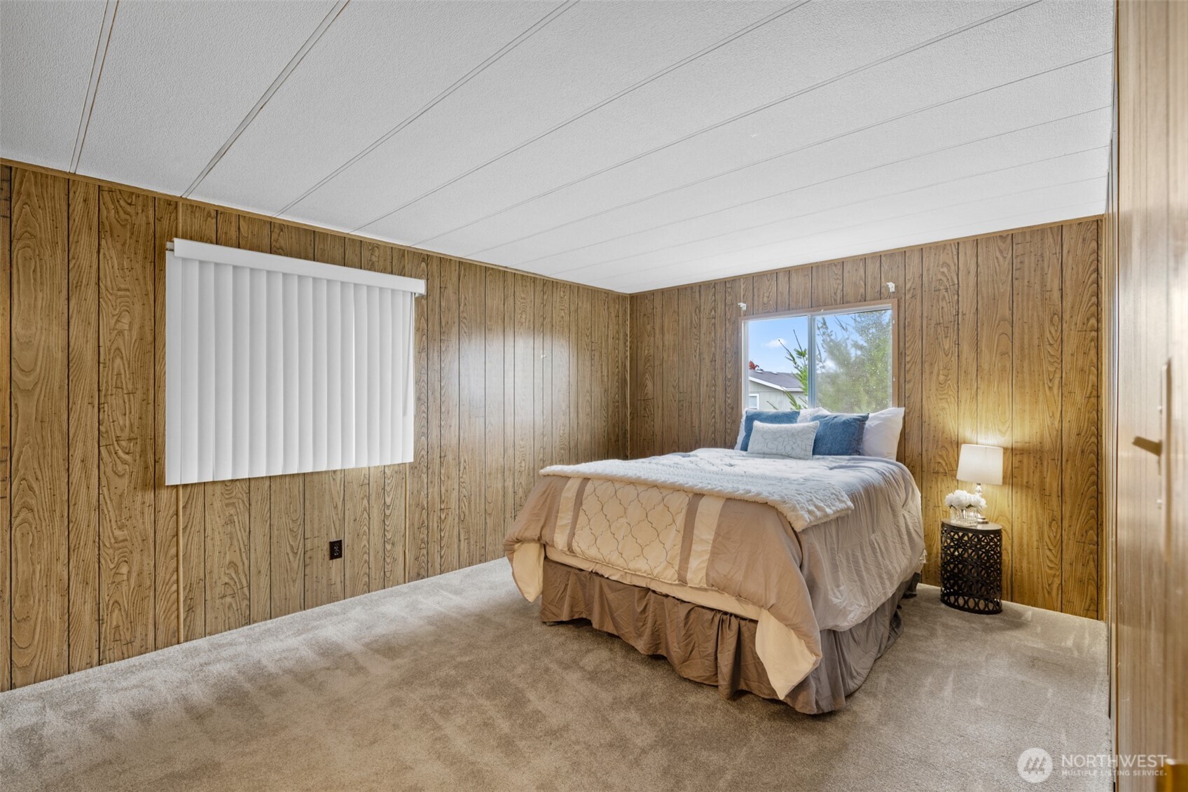 11 Juniper Mobile Estate Sequim, WA 98382 - Photo 22 of 31 a bedroom with a bed and window