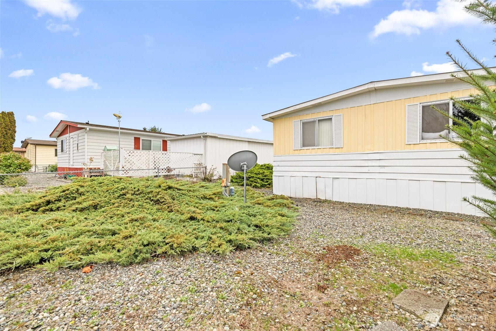 11 Juniper Mobile Estate Sequim, WA 98382 - Photo 30 of 31 a bathroom with a sink and mirror