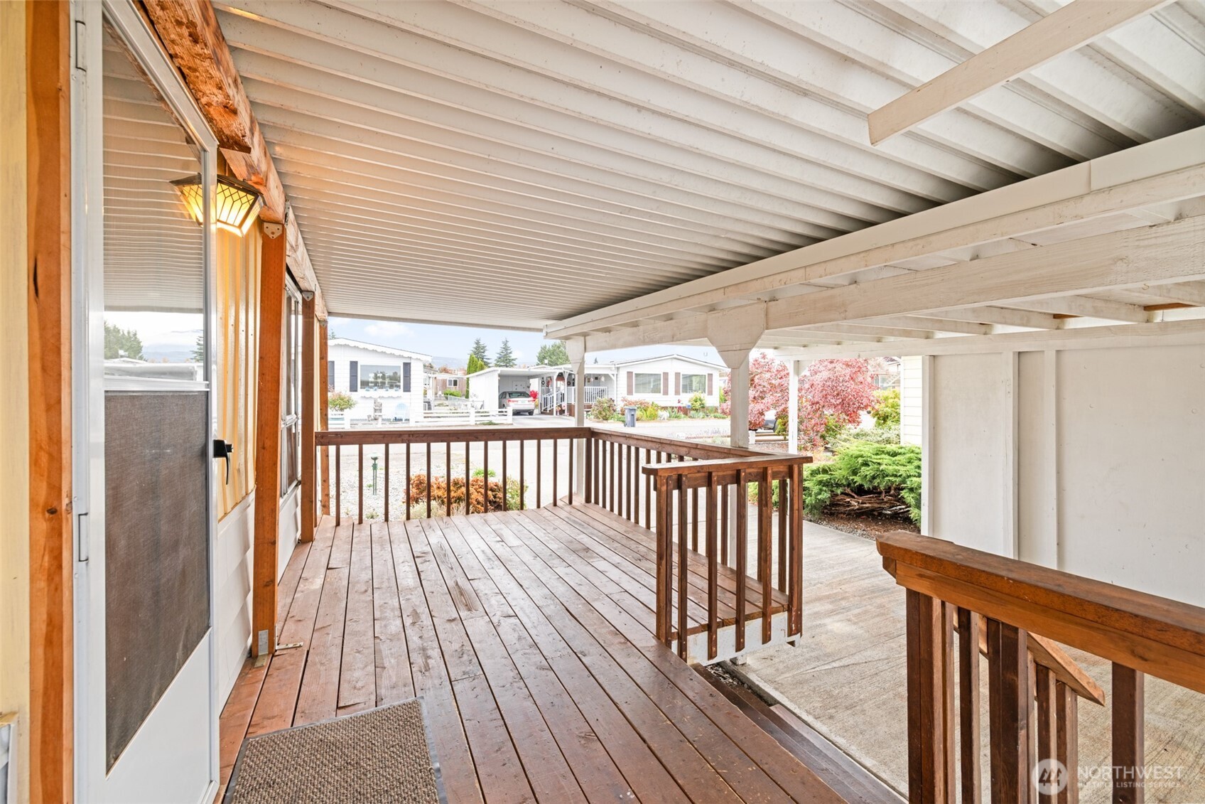 11 Juniper Mobile Estate Sequim, WA 98382 - Photo 6 of 31 a view of a balcony with wooden floor