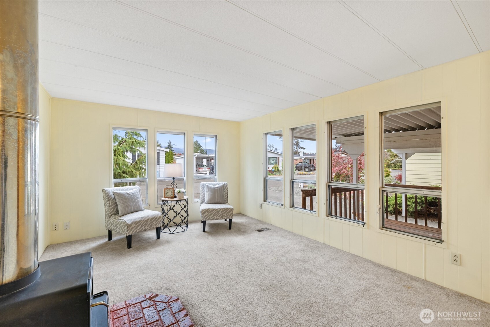 11 Juniper Mobile Estate Sequim, WA 98382 - Photo 9 of 31 a living room with furniture and large windows