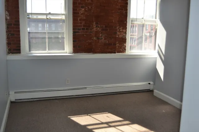 a hallway with washer and dryer