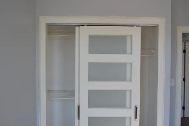 a view of an empty room with a window