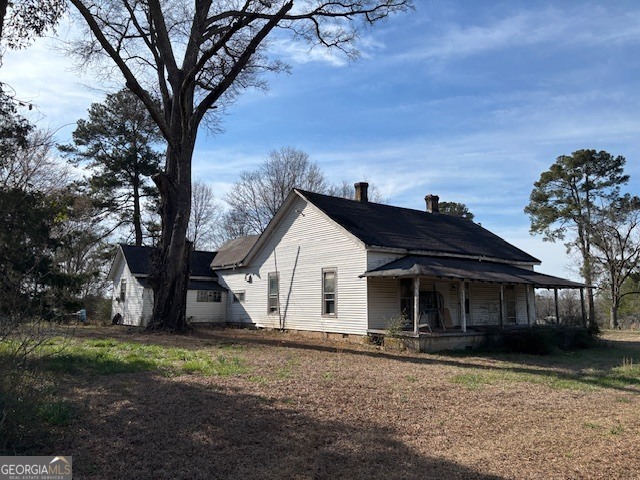 0 Barnett Road Southeast Crawfordville, GA 30631 - Photo 1 of 39 a view of a yard in front of a house with large trees