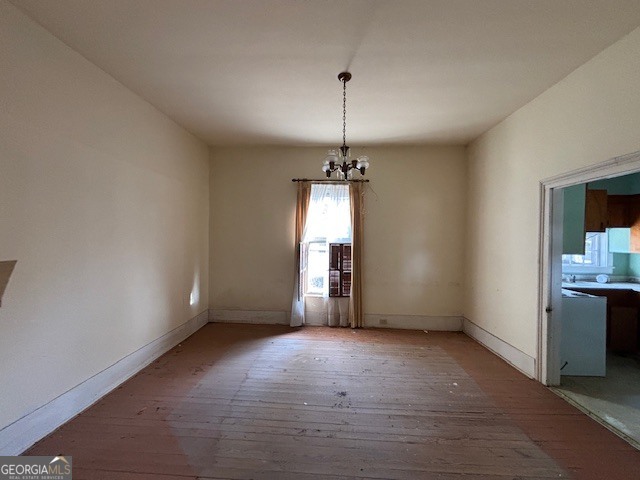 0 Barnett Road Southeast Crawfordville, GA 30631 - Photo 35 of 39 an empty room with chandelier fan and windows