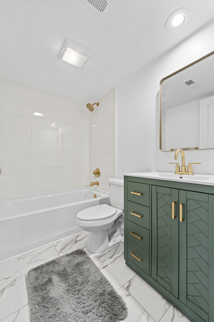 11138 Center Road, Unit D22 Palos Hills, IL 60465 - Photo 12 of 21 a bathroom with a sink a toilet and shower