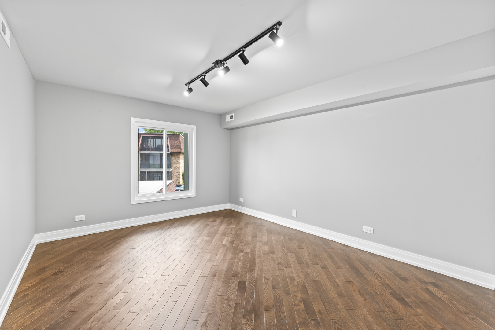11138 Center Road, Unit D22 Palos Hills, IL 60465 - Photo 13 of 21 a view of empty room with wooden floor and fan