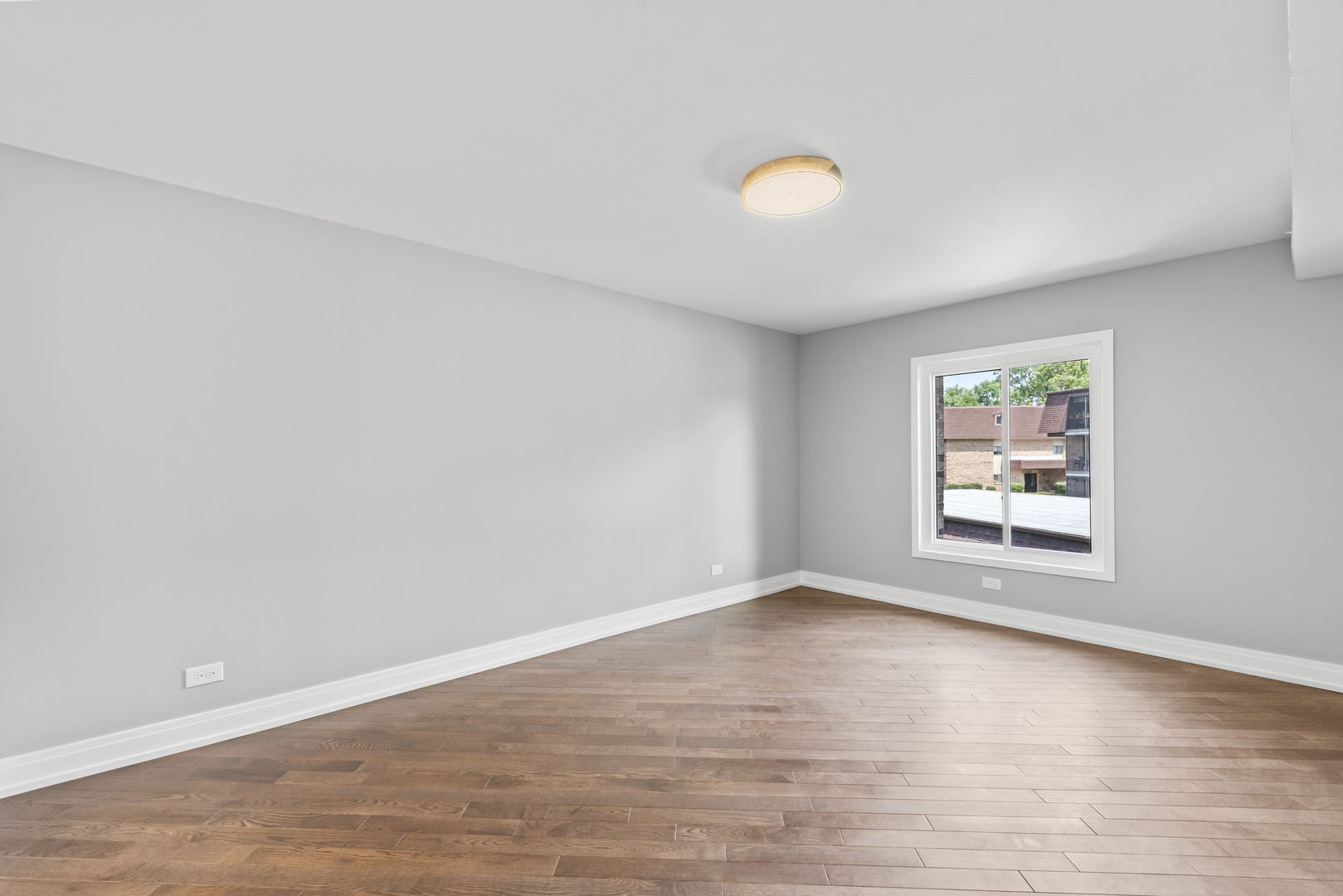 11138 Center Road, Unit D22 Palos Hills, IL 60465 - Photo 14 of 21 an empty room with wooden floor and windows