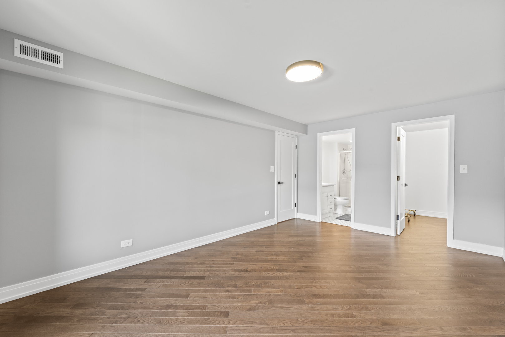 11138 Center Road, Unit D22 Palos Hills, IL 60465 - Photo 15 of 21 a view of an empty room with wooden floor and a window