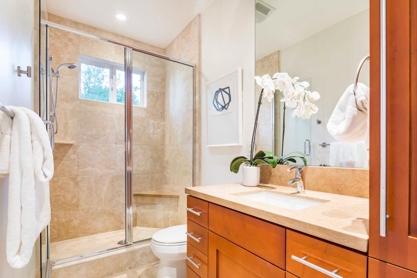 187 Hardwick Road Woodside, CA 94062 - Photo 34 of 39 a bathroom with a granite countertop sink and a mirror