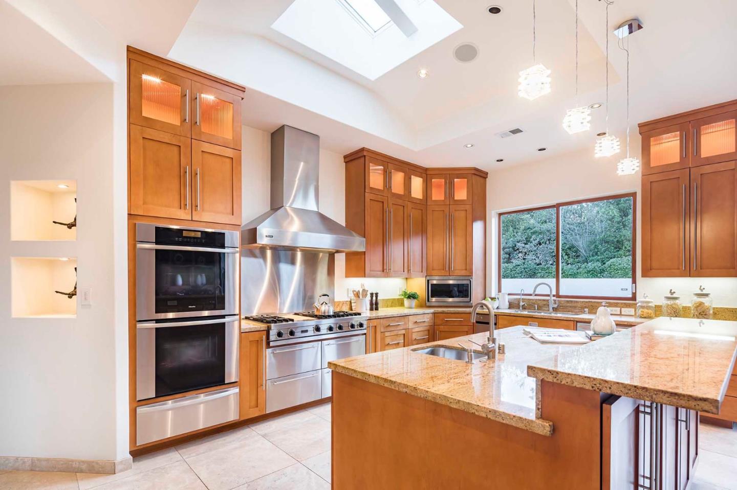 187 Hardwick Road Woodside, CA 94062 - Photo 9 of 39 a kitchen with stainless steel appliances granite countertop a stove and a refrigerator
