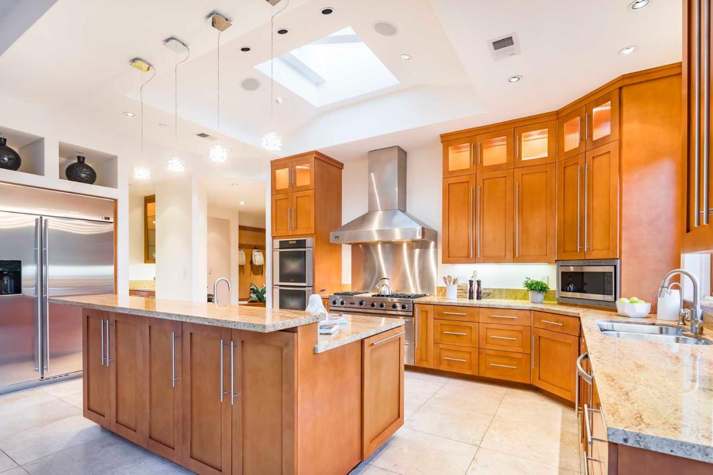 187 Hardwick Road Woodside, CA 94062 - Photo 10 of 39 a kitchen with stainless steel appliances a sink and cabinets