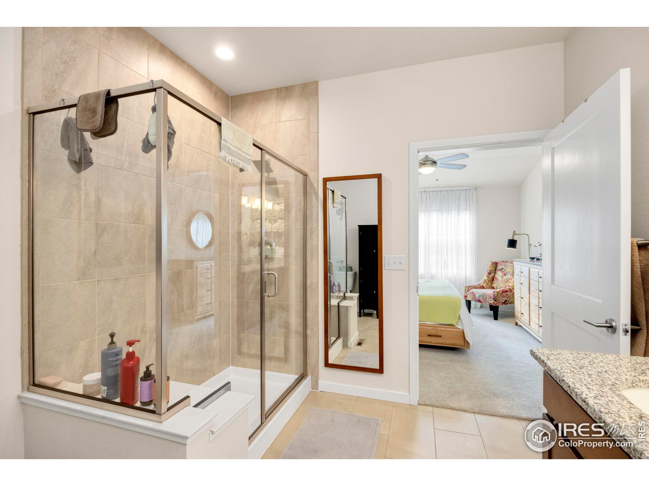 744 Wagon Trail Road, Unit 1 Fort Collins, CO 80524 - Photo 11 of 28 a bathroom with a tub shower and view of bathroom