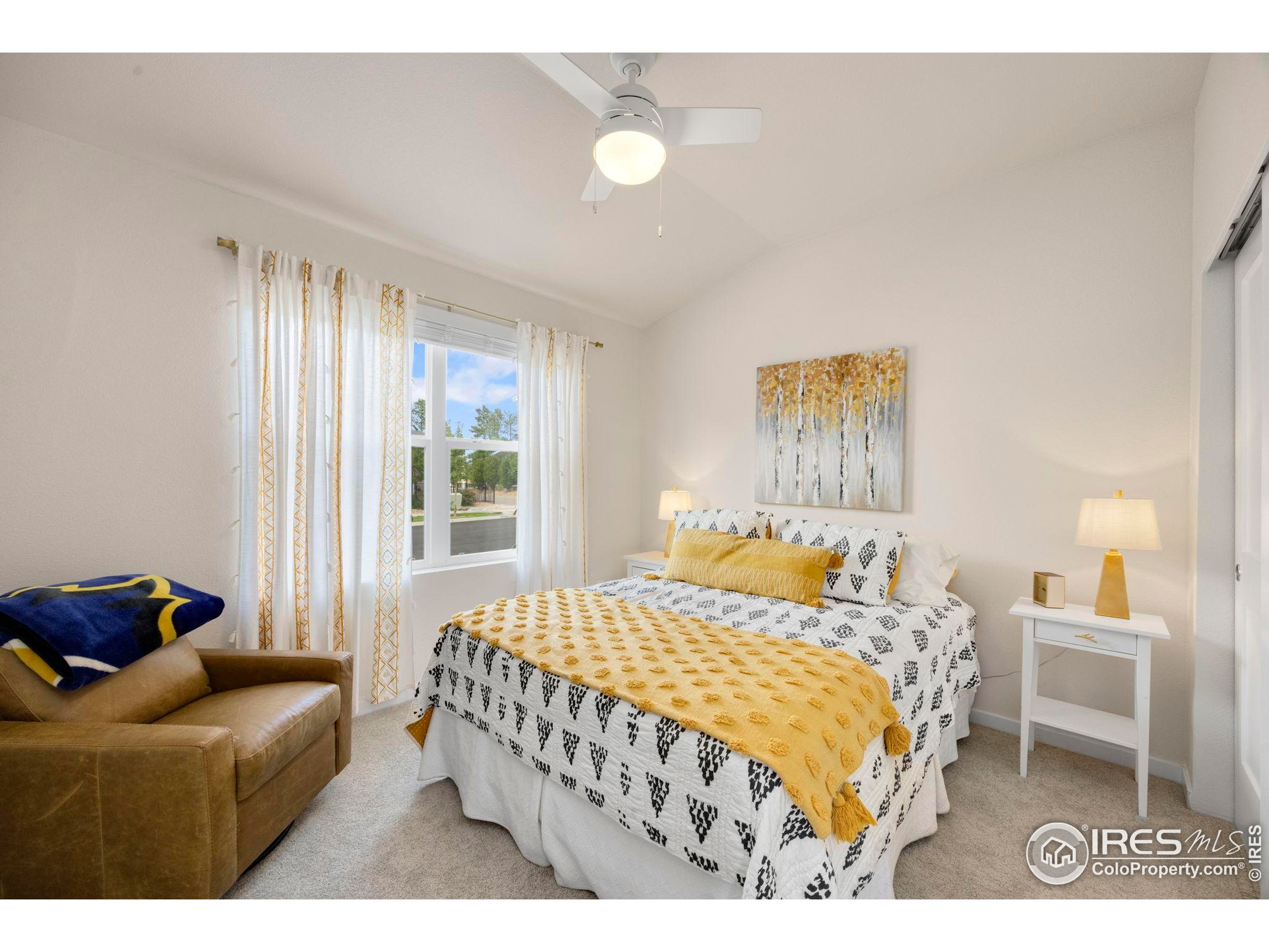 744 Wagon Trail Road, Unit 1 Fort Collins, CO 80524 - Photo 14 of 28 a bedroom with a bed and window