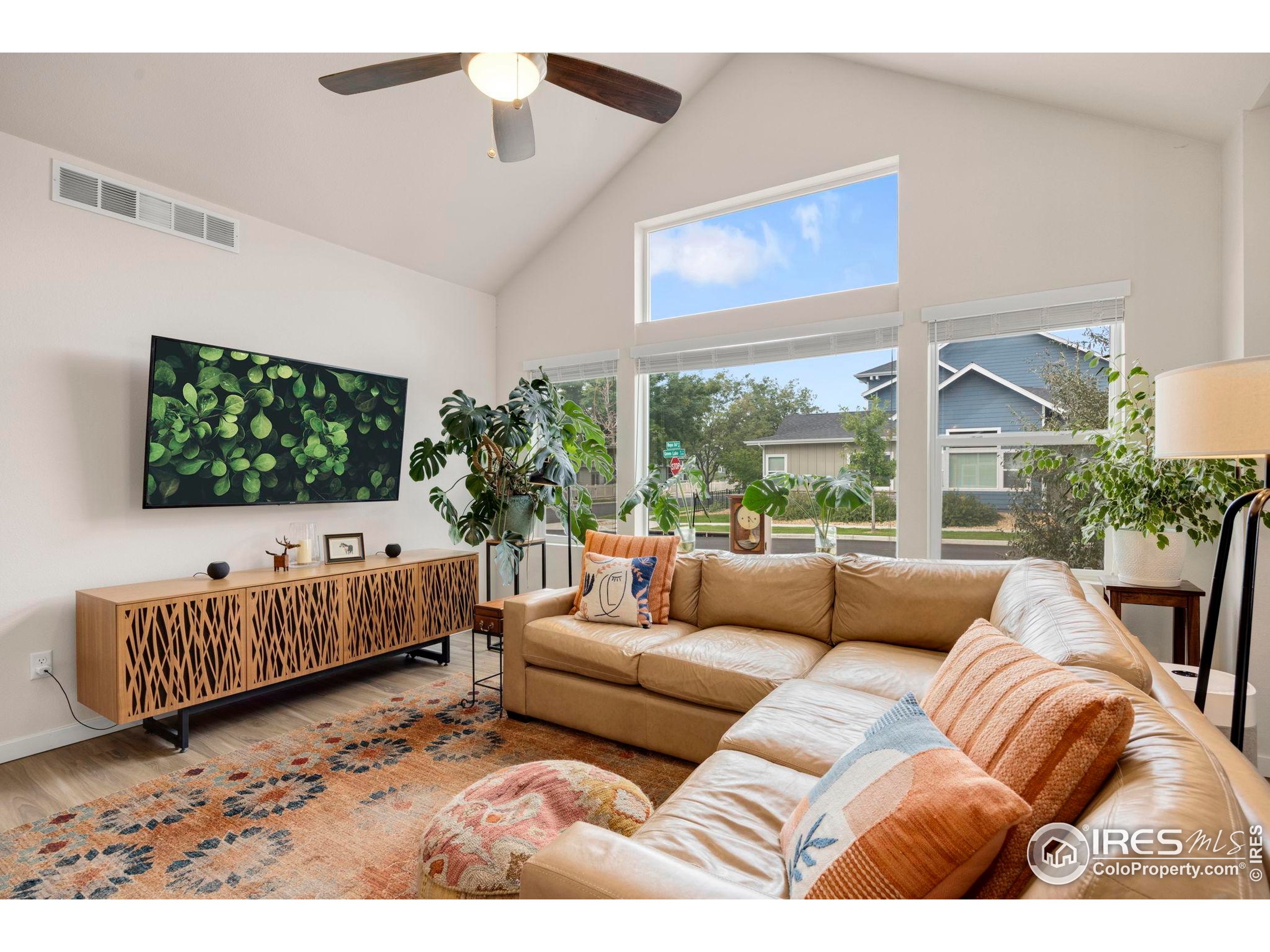 744 Wagon Trail Road, Unit 1 Fort Collins, CO 80524 - Photo 17 of 28 a living room with furniture and a flat screen tv