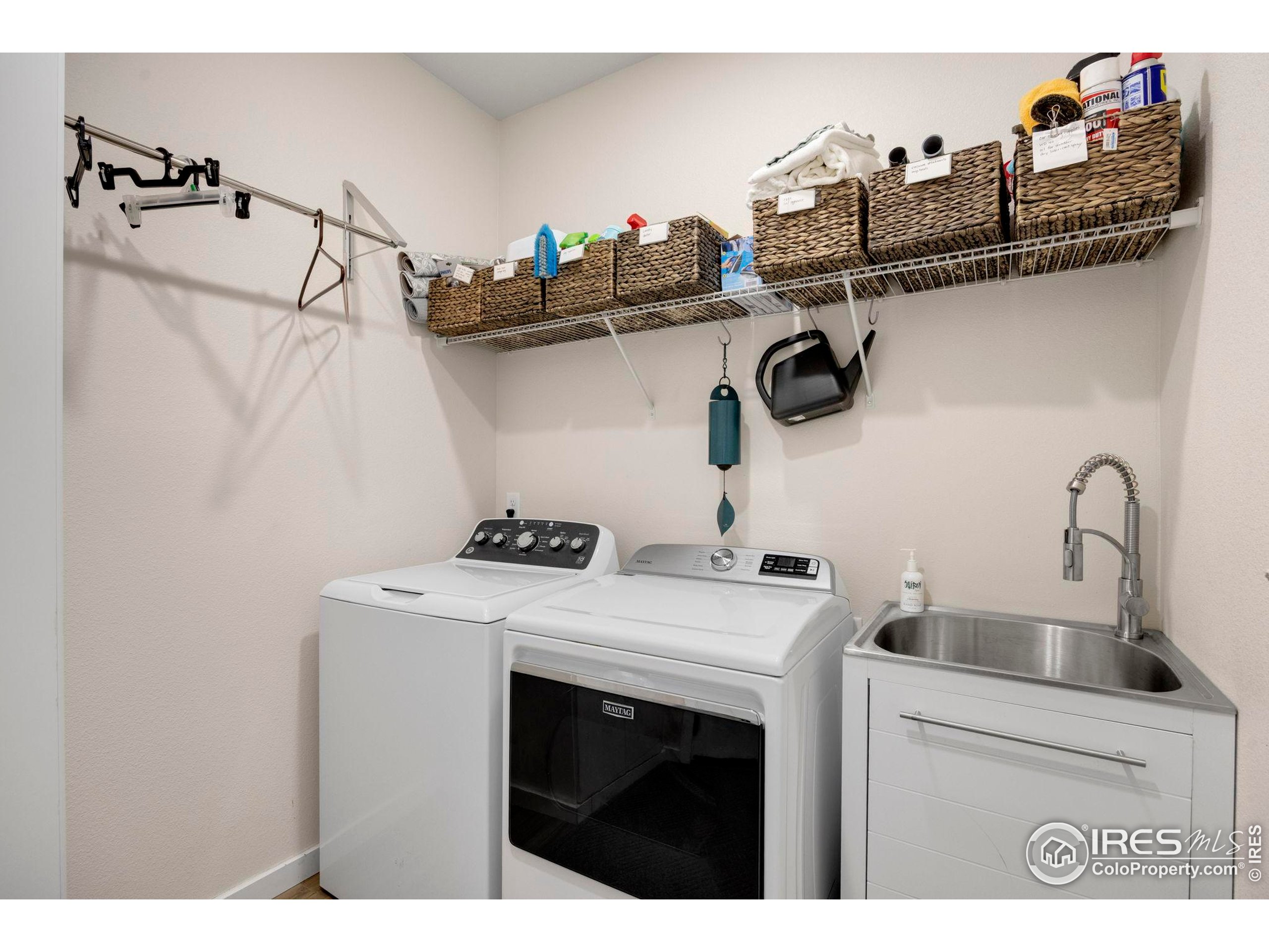 744 Wagon Trail Road, Unit 1 Fort Collins, CO 80524 - Photo 23 of 28 a kitchen with a stove and cabinets