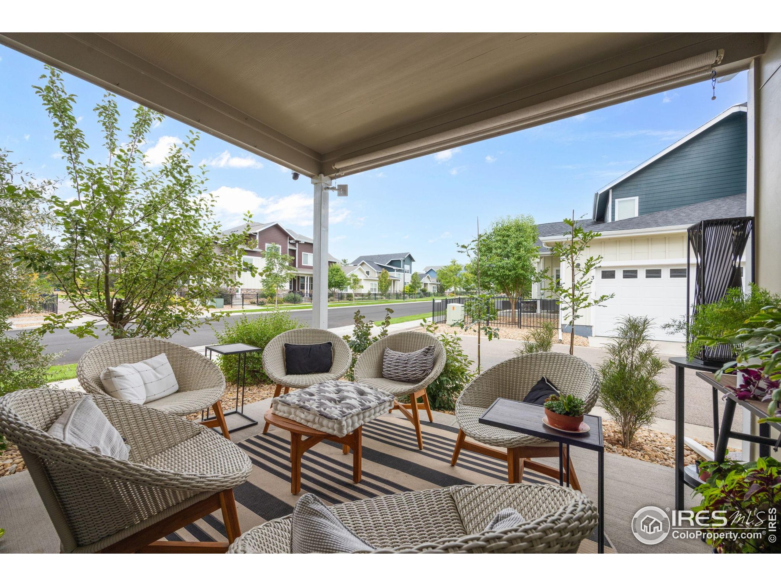 744 Wagon Trail Road, Unit 1 Fort Collins, CO 80524 - Photo 27 of 28 a view of a patio with couches chairs and a potted plant