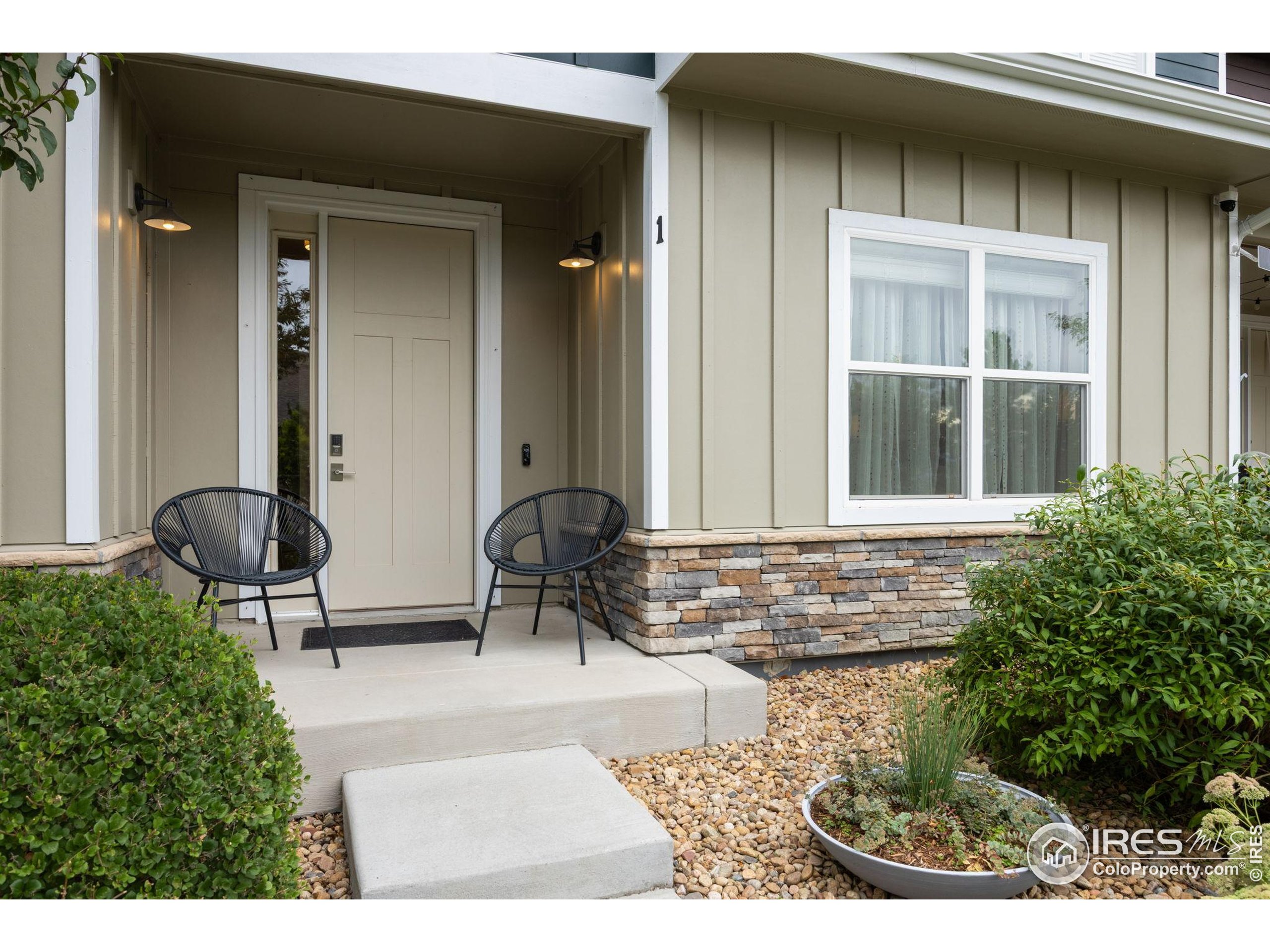 744 Wagon Trail Road, Unit 1 Fort Collins, CO 80524 - Photo 5 of 28 a front view of a house with outdoor seating