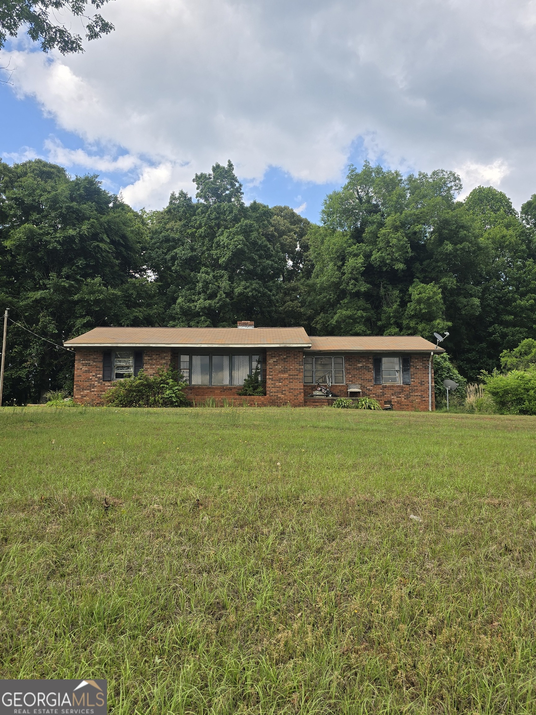 250 Brown Road Carnesville, GA 30521 - Photo 1 of 1 a front view of a house with a garden