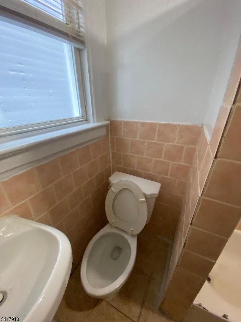 27 Pingry Place, Unit 1 Elizabeth, NJ 07208 - Photo 5 of 10 a bathroom with a toilet and a sink