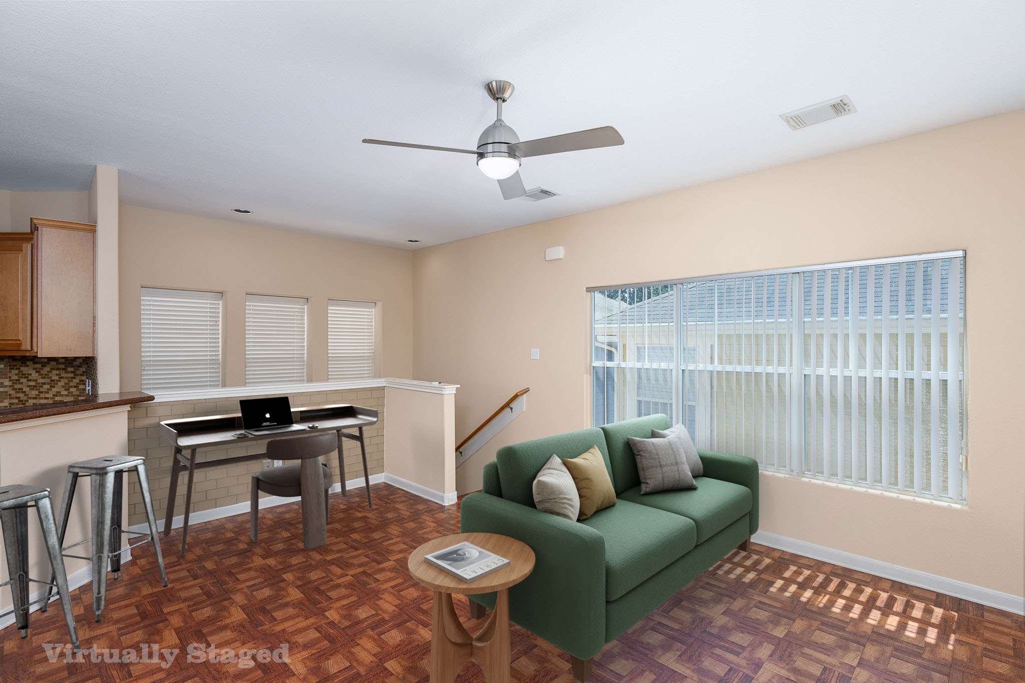 2829 Saville Loop, Unit 17C Austin, TX 78741 - Photo 3 of 28 A living space offers warm wood flooring and a modern ceiling fan, creating an inviting atmosphere.