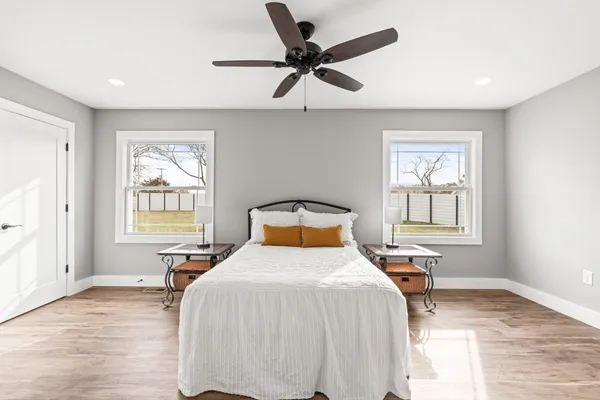 a bedroom with a bed and window