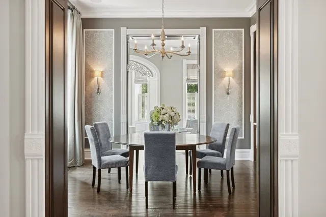 a living room with furniture large window and a fireplace