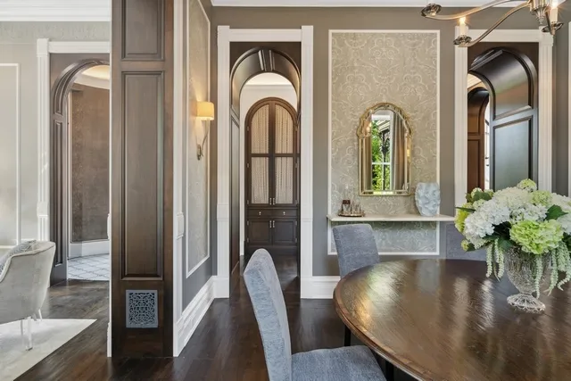 a living room with furniture fireplace and a large window