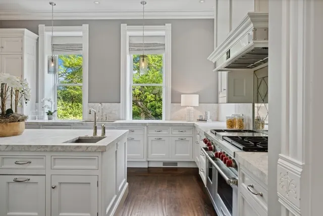 a bathroom with a sink toilet and a mirror