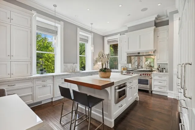 a view of a brick building with a bench in front of building