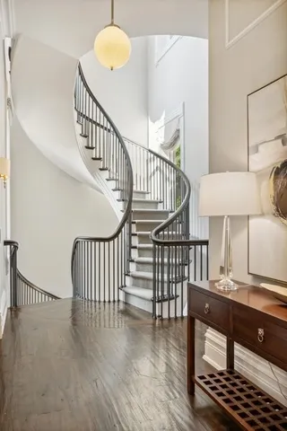 a spacious bedroom with a bed and a painting