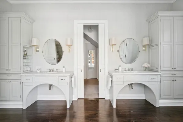 a utility room with cabinets washer and dryer