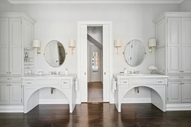 a utility room with cabinets washer and dryer