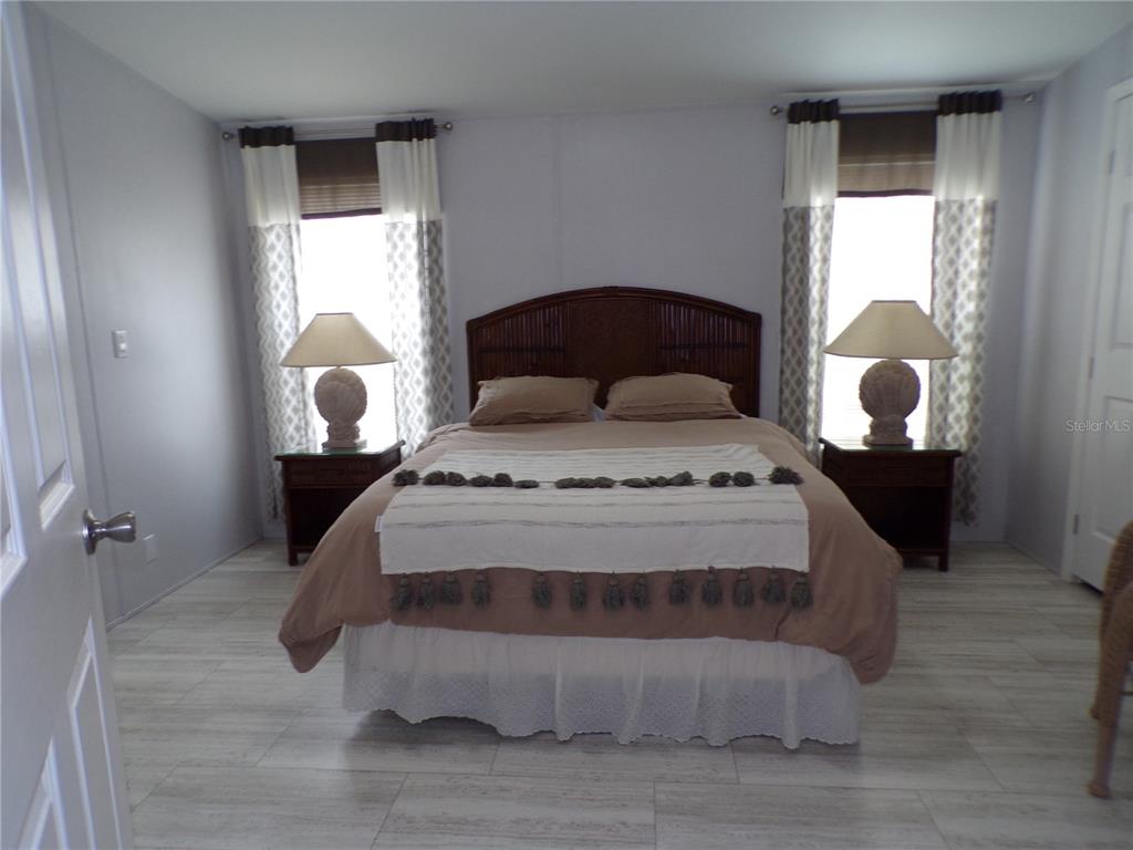 721 Marlin Drive Punta Gorda, FL 33950 - Photo 13 of 50 a bedroom with a bed and window