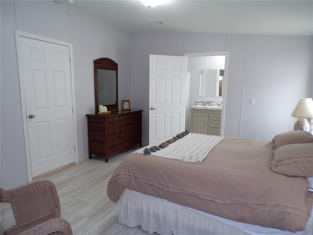 721 Marlin Drive Punta Gorda, FL 33950 - Photo 14 of 50 a bedroom with a bed and a couch
