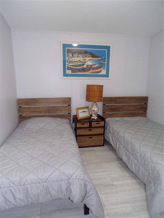 721 Marlin Drive Punta Gorda, FL 33950 - Photo 18 of 50 a bedroom with a bed and a painting on the wall