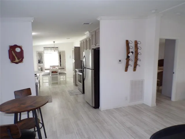 a kitchen with a table and chairs