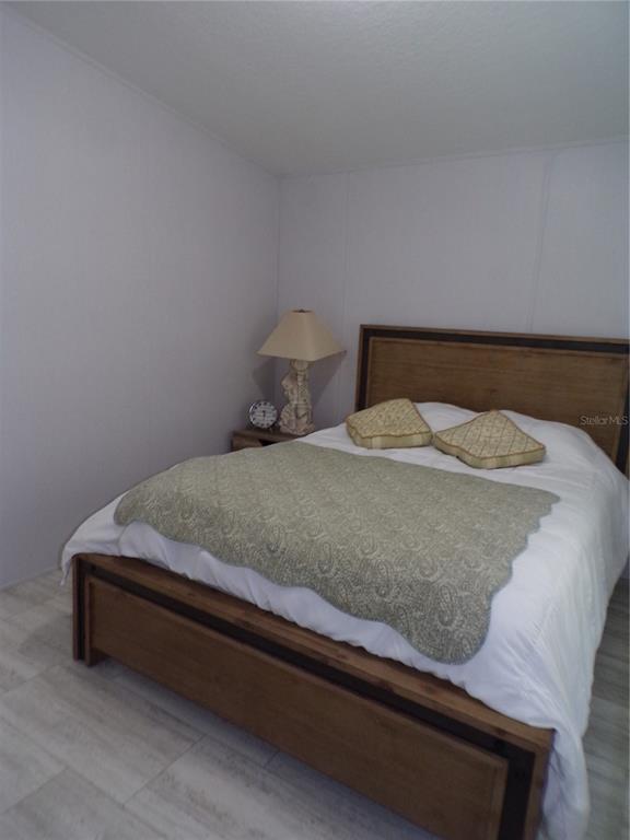 721 Marlin Drive Punta Gorda, FL 33950 - Photo 21 of 50 a bedroom with a bed and window